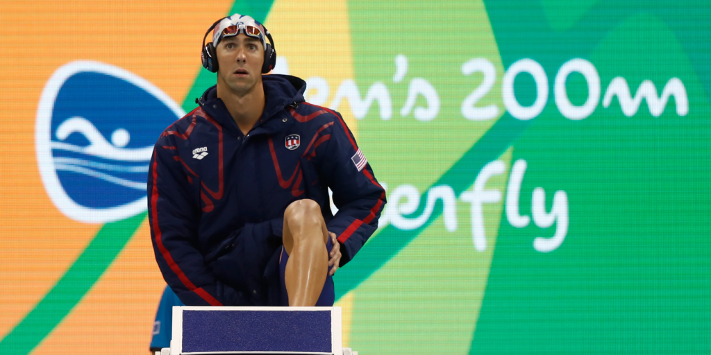 Why Do Olympic Swimmers Wear Coats Before Race